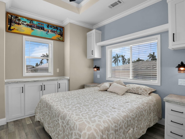 bedroom featuring multiple windows, crown molding, and dark hardwood / wood-style flooring