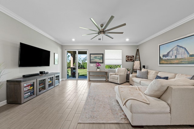 living room with crown molding, ceiling fan, and light hardwood / wood-style floors