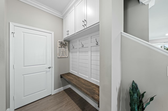 mudroom with ornamental molding and light hardwood / wood-style flooring