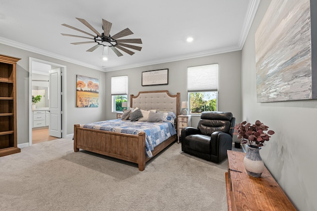 bedroom with ornamental molding, connected bathroom, light colored carpet, and ceiling fan