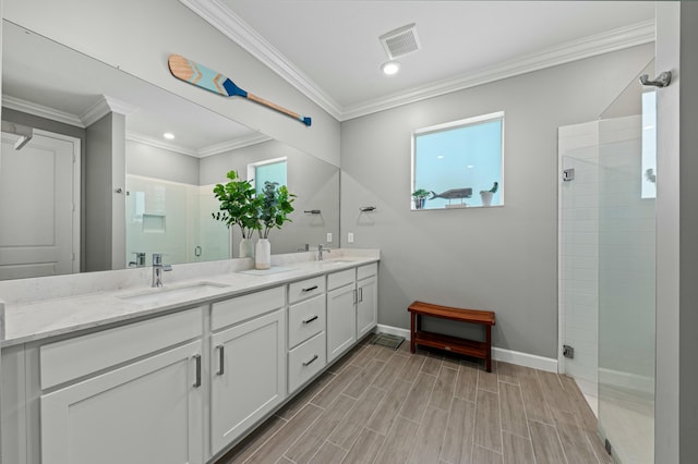 bathroom featuring crown molding, vanity, and walk in shower