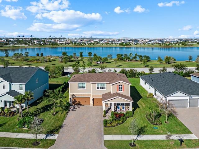 birds eye view of property featuring a water view