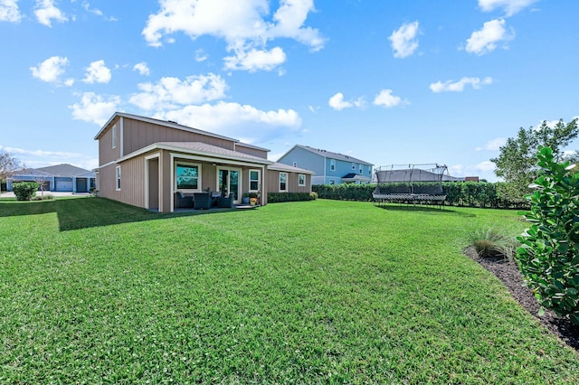 view of yard featuring an outdoor living space and a trampoline