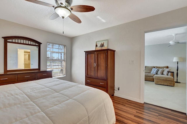 bedroom featuring ceiling fan and hardwood / wood-style floors