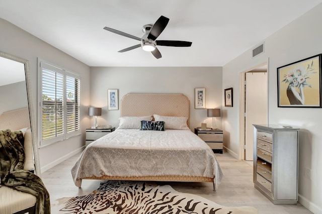 bedroom with ceiling fan and light wood-type flooring