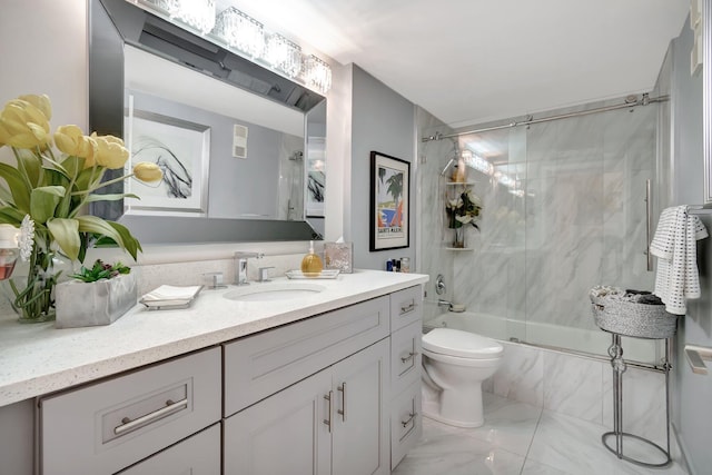 full bathroom featuring toilet, vanity, and bath / shower combo with glass door