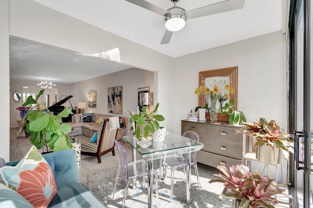 living room with ceiling fan and light wood-type flooring