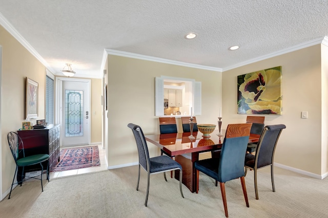 carpeted dining room featuring crown molding and a textured ceiling