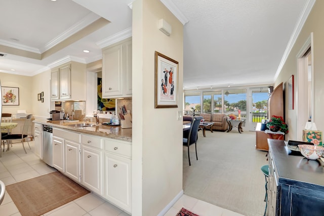 kitchen featuring ornamental molding, sink, stainless steel dishwasher, and decorative backsplash