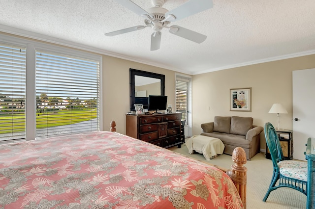 bedroom featuring ornamental molding, light carpet, and a textured ceiling