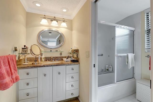 bathroom with ornamental molding, combined bath / shower with glass door, vanity, and a textured ceiling