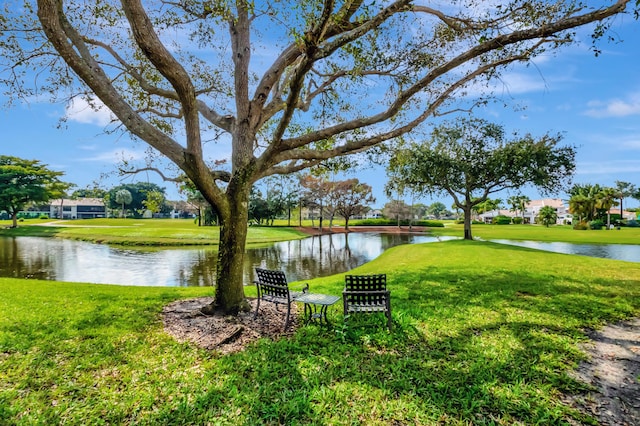 exterior space featuring a water view and a yard