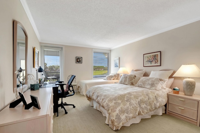 carpeted bedroom featuring ornamental molding and a textured ceiling