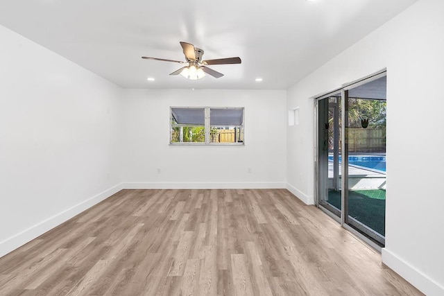 unfurnished room with ceiling fan, plenty of natural light, and light hardwood / wood-style floors