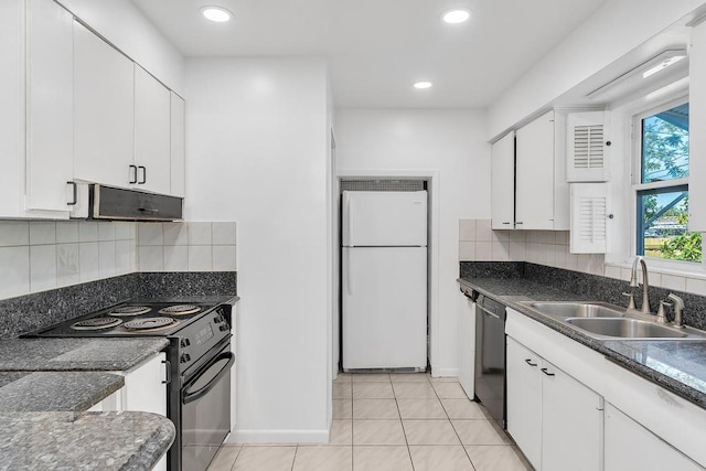 kitchen featuring sink, white cabinetry, black appliances, light tile patterned floors, and backsplash