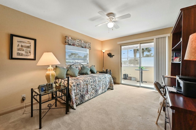 carpeted bedroom with access to outside and ceiling fan