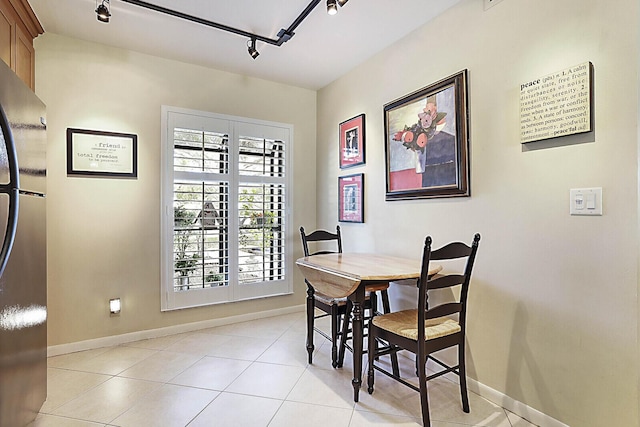 tiled dining room with track lighting