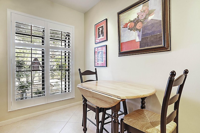 dining area featuring light tile patterned floors