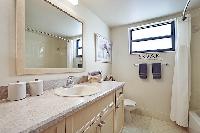 full bathroom with tile patterned floors, toilet, shower / tub combo, and vanity