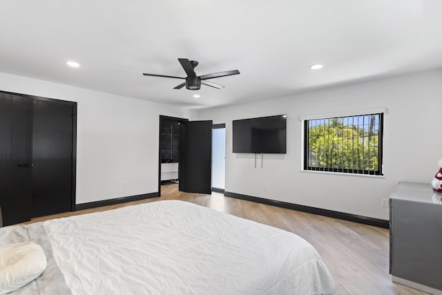 bedroom featuring light hardwood / wood-style floors and ceiling fan