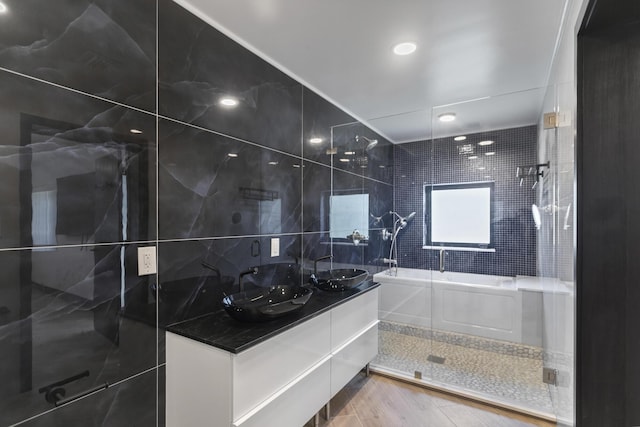 bathroom with vanity, hardwood / wood-style floors, and walk in shower