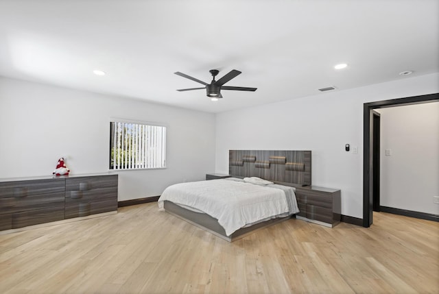 bedroom with ceiling fan and light wood-type flooring