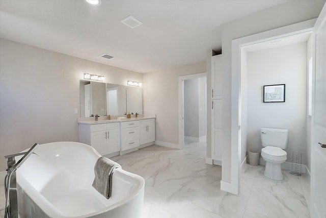 bathroom featuring vanity, toilet, and a bathing tub