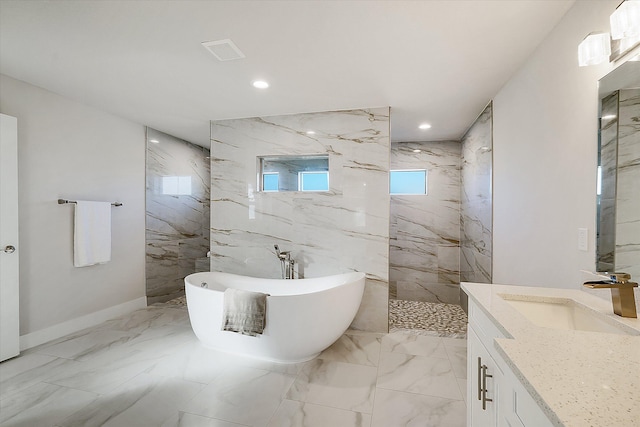 bathroom with vanity and separate shower and tub