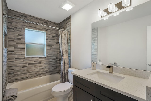 full bathroom featuring vanity, shower / bath combination with curtain, and toilet