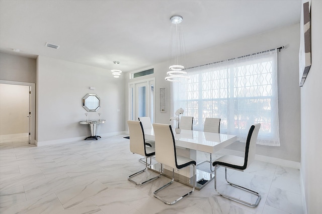 dining room with a chandelier