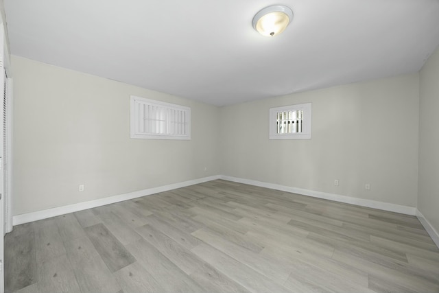 basement with light hardwood / wood-style floors