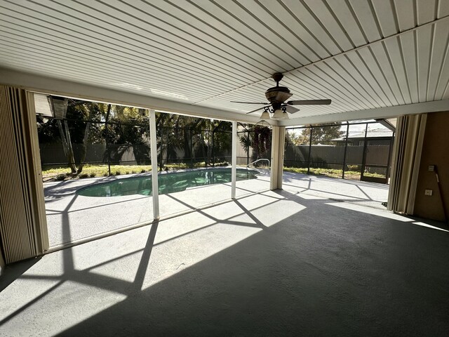 view of pool featuring ceiling fan, a lanai, and a patio