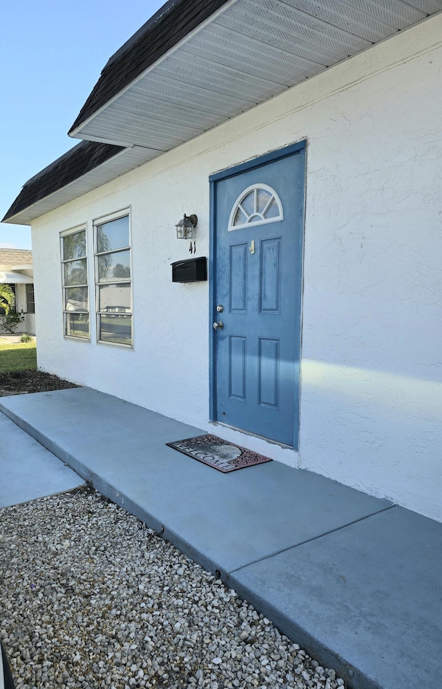 entrance to property featuring a patio area