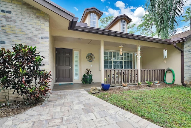 entrance to property featuring covered porch