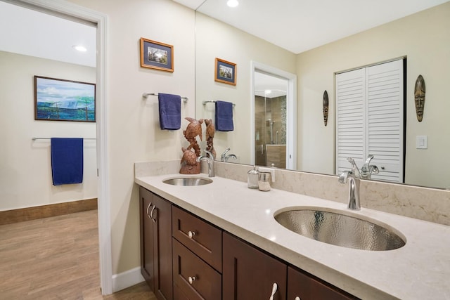 bathroom featuring vanity and wood-type flooring