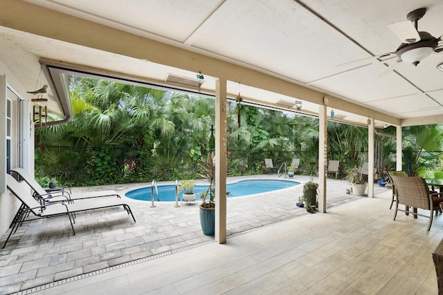 view of pool with ceiling fan and a patio area