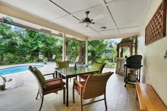 view of patio featuring area for grilling and ceiling fan