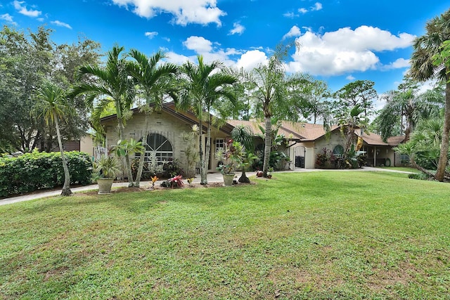 single story home with a front yard