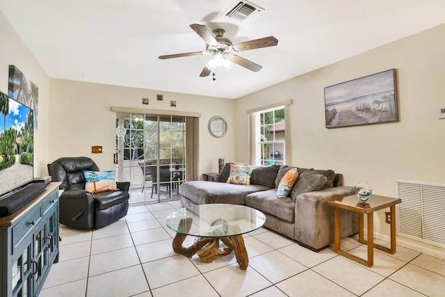 tiled living room featuring ceiling fan