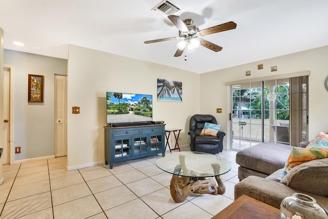 living room with ceiling fan and light tile patterned floors