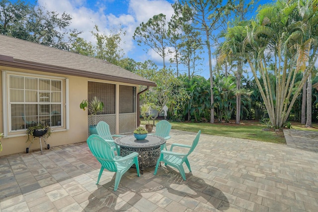 view of patio / terrace with a sunroom