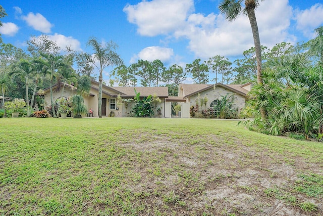 ranch-style home with a front yard