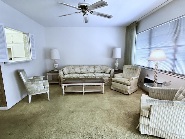 living room with carpet floors and ceiling fan