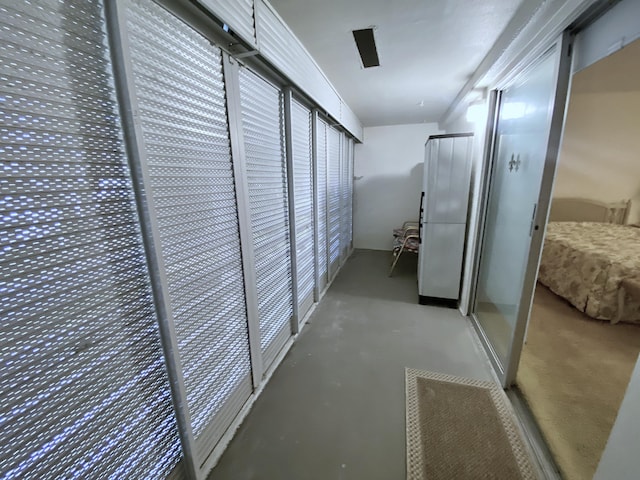 hallway featuring concrete flooring