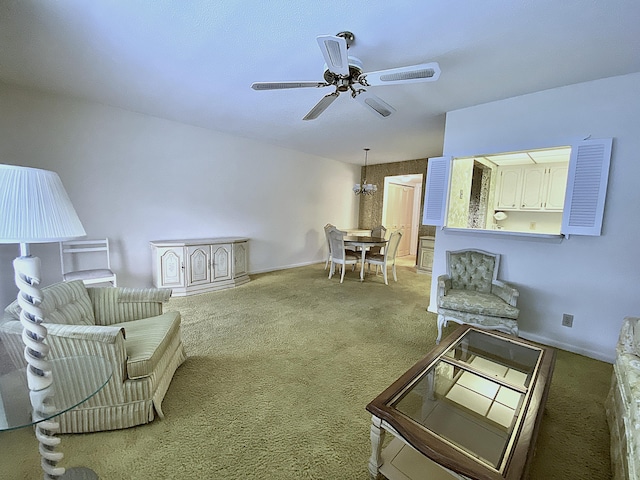 sitting room featuring ceiling fan and carpet flooring