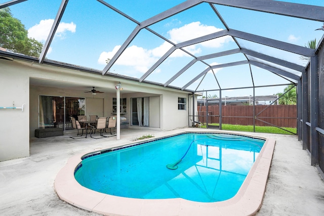 view of pool featuring a patio, a lanai, and ceiling fan