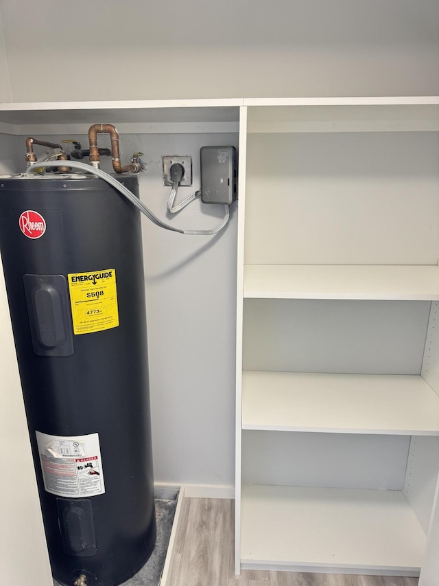 utility room featuring electric water heater