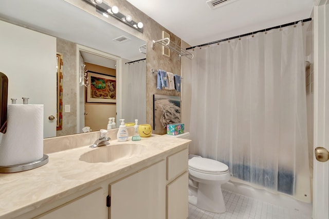 full bathroom featuring vanity, toilet, tile patterned floors, and shower / tub combo with curtain