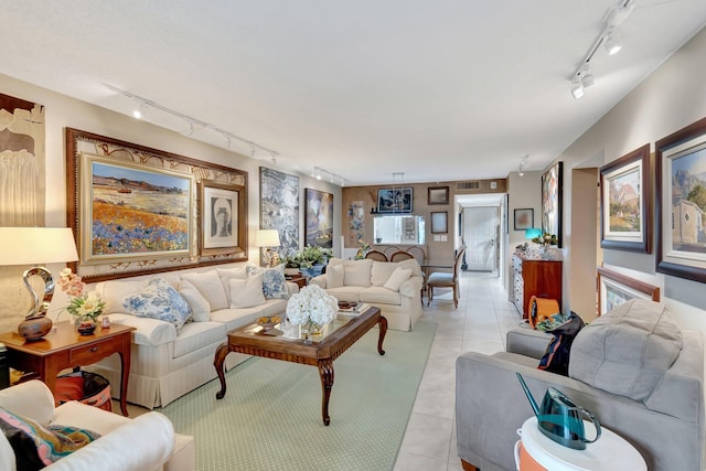 living room with light tile patterned flooring and rail lighting