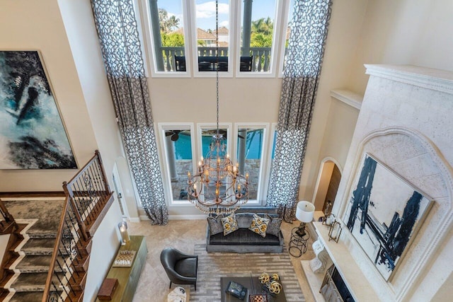 living room with a high ceiling and a notable chandelier